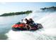 Couple speeding on a jet ski across a lake at 4375 Reed Creek Dr, Sherrills Ford, NC 28673