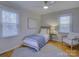 Inviting bedroom with a single bed, chair, and ample natural light at 4614 Halstead Dr, Charlotte, NC 28209