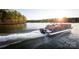 Gathering enjoying a pontoon boat ride at sunset at 7109 Brookview Ln, Sherrills Ford, NC 28673