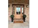 Elegant front door with sidelights and a welcoming mat at 15906 Youngblood Rd, Charlotte, NC 28278