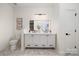 Elegant bathroom with double vanity, marble floors, and modern fixtures at 15906 Youngblood Rd, Charlotte, NC 28278