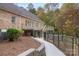 Brick house with deck, walkway, and fenced yard at 15906 Youngblood Rd, Charlotte, NC 28278