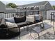 Relax on this rooftop deck, featuring a sectional sofa and glass-top coffee table at 2051 Clarksdale Dr # 29, Charlotte, NC 28206