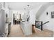 Open concept kitchen with island and view into dining area at 2051 Clarksdale Dr # 29, Charlotte, NC 28206