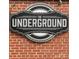 Image of The Underground building signage on brick wall at 2051 Clarksdale Dr # 29, Charlotte, NC 28206