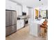 Modern kitchen featuring white cabinets and a large island at 2051 Clarksdale Dr # 29, Charlotte, NC 28206