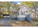 House exterior with gray siding, front porch, and carport at 220 East St, Albemarle, NC 28001