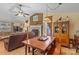 Living room with fireplace, wood dining table, and decorative hutch at 2929 Matoka Trl, Matthews, NC 28104