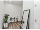 Small landing area with plants and a full-length mirror at 303 Grove Gate Ln, Indian Trail, NC 28079