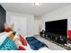 Spacious bedroom with a large TV and plenty of room for furniture at 303 Grove Gate Ln, Indian Trail, NC 28079