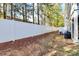 White vinyl fence encloses a private backyard at 303 Grove Gate Ln, Indian Trail, NC 28079