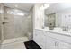 Elegant bathroom with double vanity, large shower, and built-in shelving at 303 Grove Gate Ln, Indian Trail, NC 28079