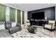 Modern living room features a sectional sofa, a large TV, and stylish decor at 303 Grove Gate Ln, Indian Trail, NC 28079