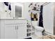 Clean bathroom with white vanity, shower, and updated fixtures at 303 Grove Gate Ln, Indian Trail, NC 28079