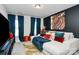 Bright living room featuring a comfy couch and artistic decor at 303 Grove Gate Ln, Indian Trail, NC 28079