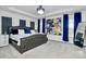 Main bedroom with tufted headboard bed, large artwork, and blue curtains at 303 Grove Gate Ln, Indian Trail, NC 28079