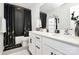 Clean bathroom with double vanity and black and gold accents at 303 Grove Gate Ln, Indian Trail, NC 28079