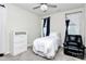 Cozy bedroom with a single bed and comfortable recliner at 303 Grove Gate Ln, Indian Trail, NC 28079