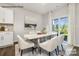 Elegant dining room with a table for six and sliding glass doors to backyard at 8039 Plymouth Dr, Sherrills Ford, NC 28673