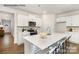 Modern kitchen with white cabinets, large island, and stainless steel appliances at 8039 Plymouth Dr, Sherrills Ford, NC 28673