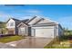 One-story home with stone and gray siding, and a two-car garage at 8039 Plymouth Dr, Sherrills Ford, NC 28673