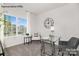 Home office with a glass desk and comfy chair at 8039 Plymouth Dr, Sherrills Ford, NC 28673