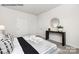 Primary bedroom with a console table and large bed at 8039 Plymouth Dr, Sherrills Ford, NC 28673