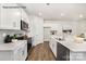 Modern kitchen with white cabinets, stainless steel appliances, and an eat-in island at 8039 Plymouth Dr, Sherrills Ford, NC 28673