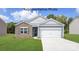 One-story home with stone and gray siding, and a two-car garage at 8039 Plymouth Dr, Sherrills Ford, NC 28673