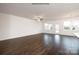 Open living room with hardwood floors and access to patio at 8047 Plymouth Dr, Sherrills Ford, NC 28673