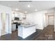 Open concept kitchen with granite island and hardwood floors at 8047 Plymouth Dr, Sherrills Ford, NC 28673