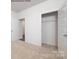 Well-lit bedroom with carpet and a closet at 8047 Plymouth Dr, Sherrills Ford, NC 28673