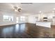 Open concept living room and kitchen with hardwood floors at 8047 Plymouth Dr, Sherrills Ford, NC 28673