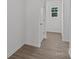 Bright hallway with wood-look floors and a small window at 1010 Kenton Pl, Salisbury, NC 28146