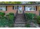 Brick steps with metal railing leading to front door at 1226 Fern Forest Dr, Gastonia, NC 28054