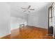 Hardwood floor bedroom with ceiling fan and double door closet at 1226 Fern Forest Dr, Gastonia, NC 28054