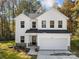 Two-story white house, two-car garage, fall foliage at 1403 Gentry Pl, Salisbury, NC 28146