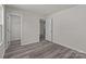 Bright bedroom with wood-look floors and a spacious closet at 1403 Gentry Pl, Salisbury, NC 28146