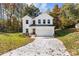 Two story home, white exterior, two car garage, fall leaves at 1403 Gentry Pl, Salisbury, NC 28146