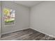 Spacious bedroom with hardwood floors and a window at 1403 Gentry Pl, Salisbury, NC 28146