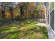 Small backyard with trees, patio, and AC unit at 1403 Gentry Pl, Salisbury, NC 28146