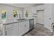 Modern kitchen with white cabinets, granite countertops, and stainless steel appliances at 1403 Gentry Pl, Salisbury, NC 28146