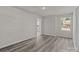 Well-lit bedroom featuring hardwood floors and a window at 1403 Gentry Pl, Salisbury, NC 28146
