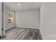 Simple bedroom featuring wood-look floors and a window with natural light at 1403 Gentry Pl, Salisbury, NC 28146