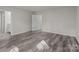 Bedroom with wood-look floors and access to bathroom at 1403 Gentry Pl, Salisbury, NC 28146