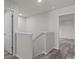 Upstairs hallway with neutral walls and hardwood floors at 1403 Gentry Pl, Salisbury, NC 28146