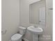 Simple bathroom with pedestal sink and white toilet at 1403 Gentry Pl, Salisbury, NC 28146