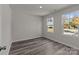 Bright bedroom with hardwood floors and two windows at 1403 Gentry Pl, Salisbury, NC 28146