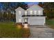 Two-story white house with a two-car garage at 1403 Gentry Pl, Salisbury, NC 28146