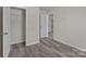 Well-lit bedroom with hardwood floors and a closet at 1403 Gentry Pl, Salisbury, NC 28146